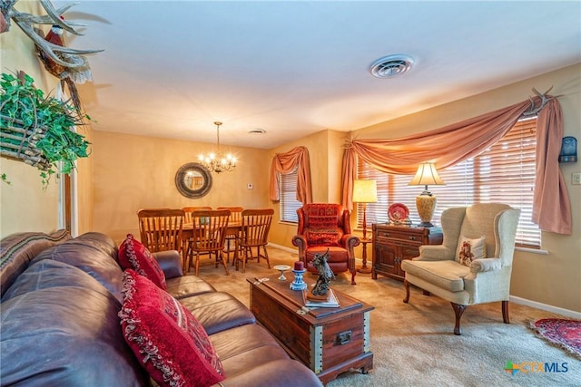 808 E Randall St, Beeville, TX 78102 - carpeted living room with a chandelier and plenty of natural light