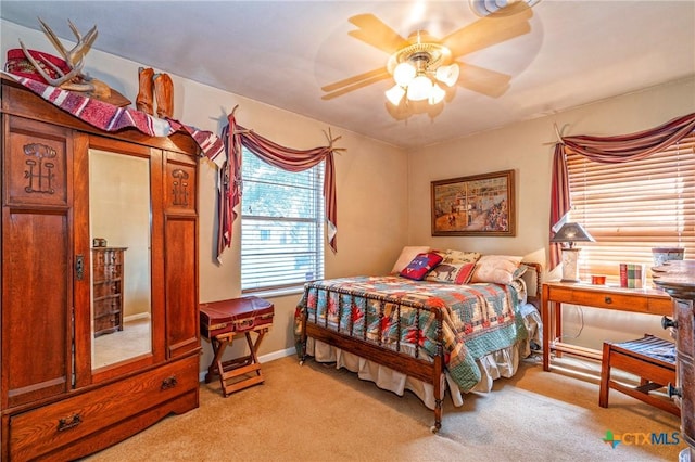 808 E Randall St, Beeville, TX 78102 - bedroom featuring light carpet and ceiling fan
