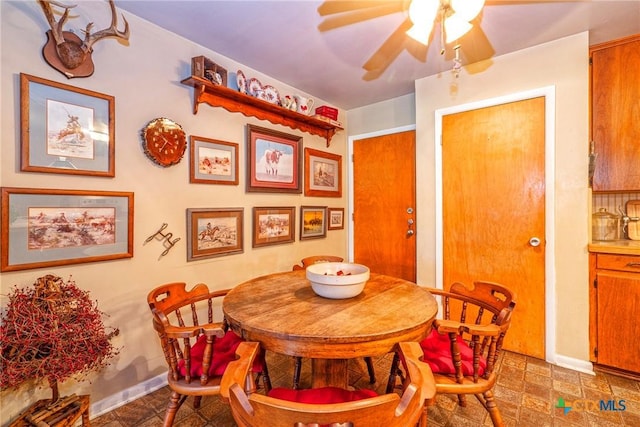 808 E Randall St, Beeville, TX 78102 - dining area featuring a ceiling fan and baseboards