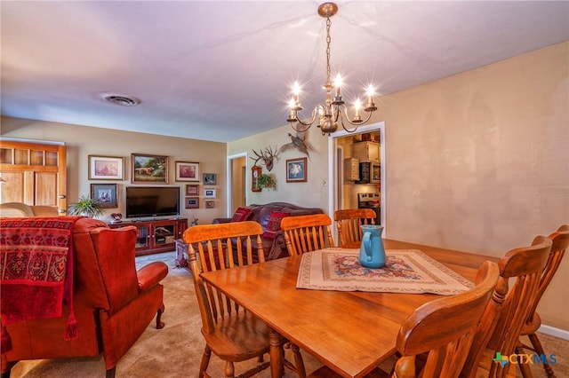 808 E Randall St, Beeville, TX 78102 - dining area featuring carpet and a chandelier
