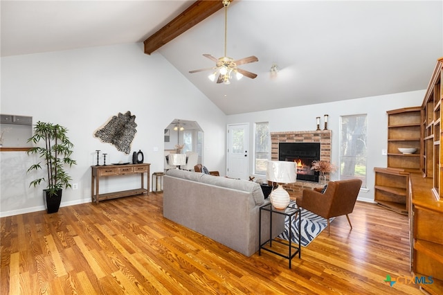 living room featuring hardwood / wood-style floors, plenty of natural light, and ceiling fan