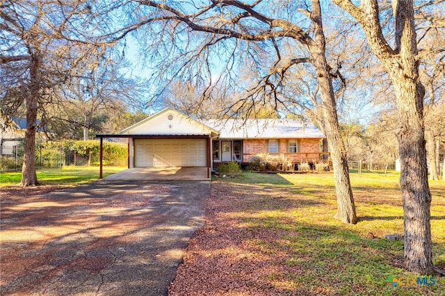 single story home with a garage and a front lawn