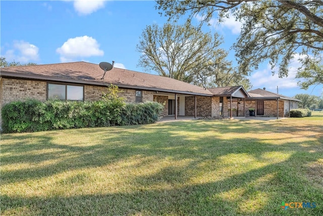 view of front of property featuring a patio area and a front lawn