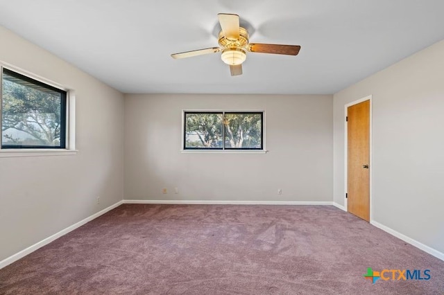 empty room featuring carpet floors and ceiling fan