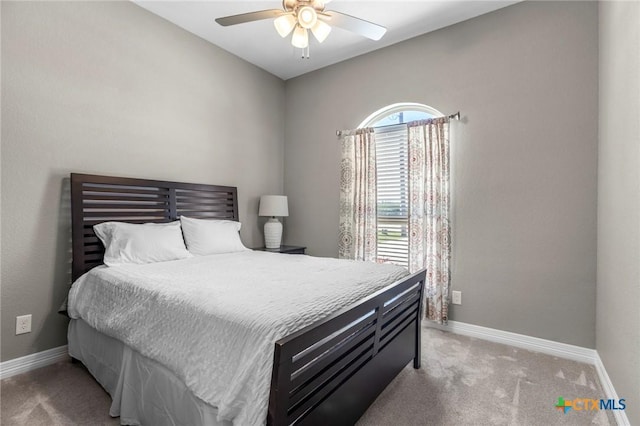 bedroom featuring carpet, a ceiling fan, and baseboards