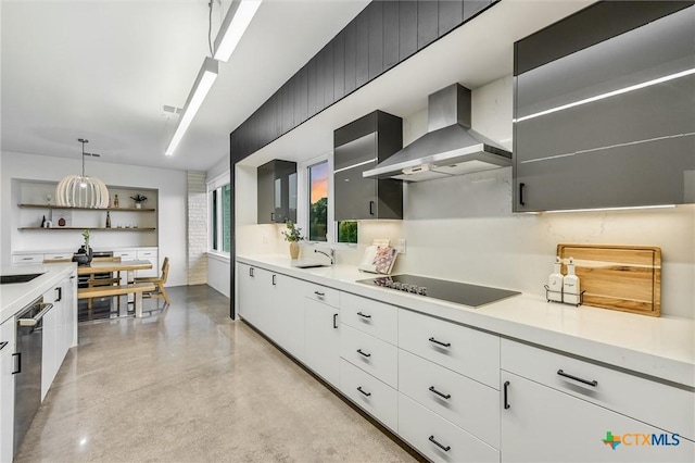 kitchen featuring white cabinetry, decorative light fixtures, black electric stovetop, wall chimney exhaust hood, and stainless steel dishwasher