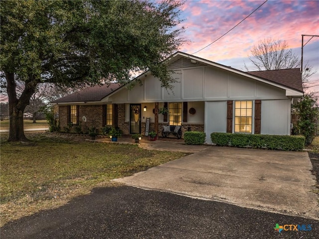 single story home featuring a yard and a porch