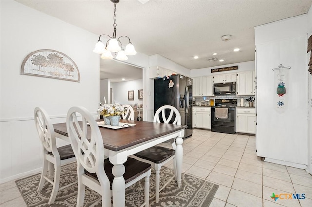 109 E Moonlight Dr, Robinson, TX 76706 - dining space with an inviting chandelier and light tile patterned floors