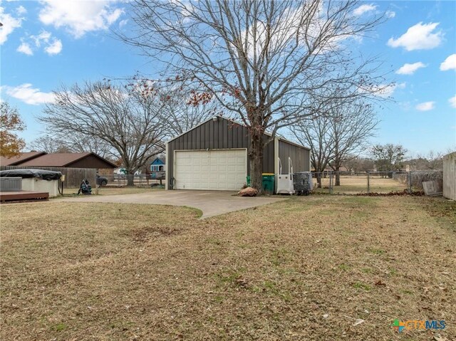 109 E Moonlight Dr, Robinson, TX 76706 - view of home's exterior featuring a garage, a yard, and an outbuilding
