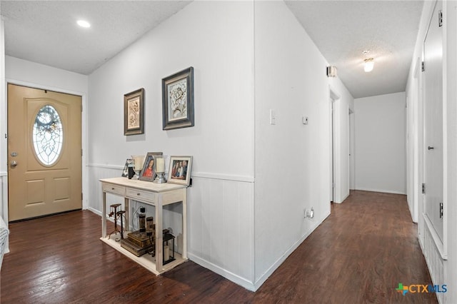 109 E Moonlight Dr, Robinson, TX 76706 - foyer entrance featuring dark hardwood / wood-style flooring and a textured ceiling