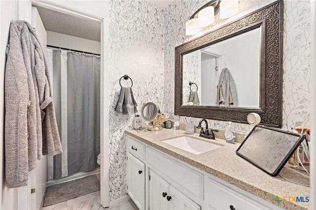 109 E Moonlight Dr, Robinson, TX 76706 - bathroom with toilet, vanity, and a shower with shower curtain