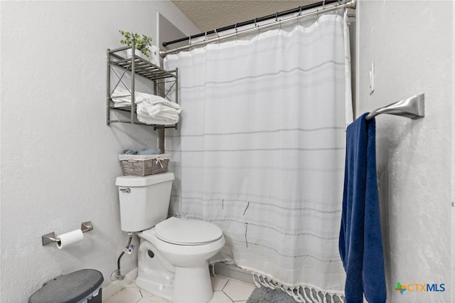 109 E Moonlight Dr, Robinson, TX 76706 - bathroom featuring toilet, tile patterned flooring, and a textured ceiling