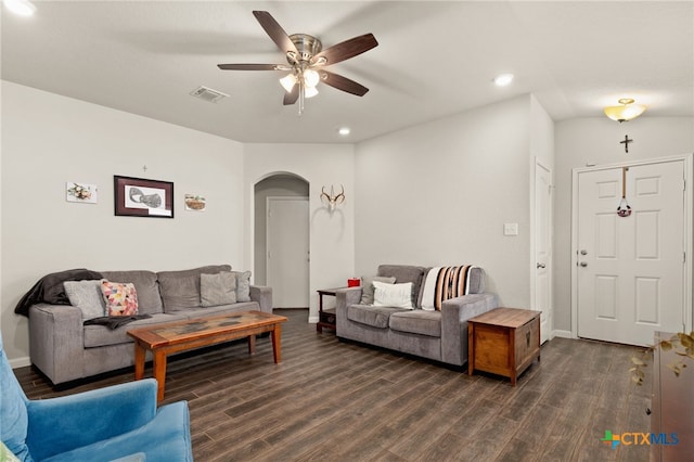 living room featuring dark hardwood / wood-style flooring and ceiling fan