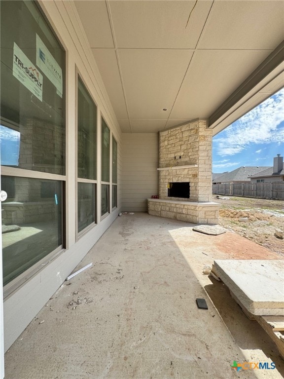 1249 Bending Branch Way, Temple, TX 76502 - view of patio with an outdoor stone fireplace