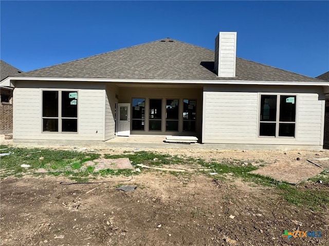 1249 Bending Branch Way, Temple, TX 76502 - rear view of property with roof with shingles and a chimney