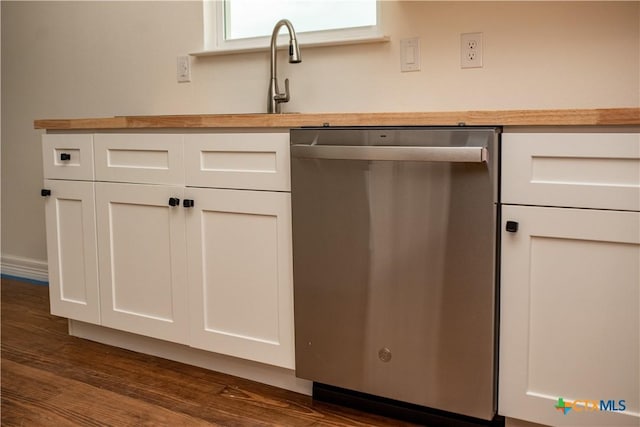 177 Powderhorn Ln, Port Lavaca, TX 77979 - kitchen view of dishwasher, butcher block counters, white cabinetry, and dark wood-type flooring