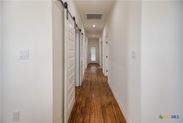 177 Powderhorn Ln, Port Lavaca, TX 77979 - hallway with a barn door, dark wood-style floors, and recessed lighting