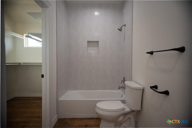 177 Powderhorn Ln, Port Lavaca, TX 77979 - bathroom with wood finished floors, tub / shower combination, and a spacious closet