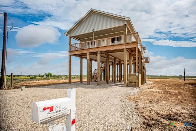 177 Powderhorn Ln, Port Lavaca, TX 77979 - coastal inspired home with a carport, driveway, and stairs