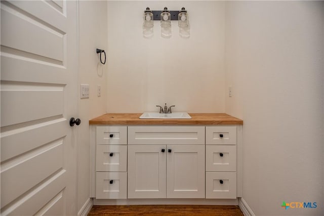 177 Powderhorn Ln, Port Lavaca, TX 77979 - bathroom with vanity and wood finished floors
