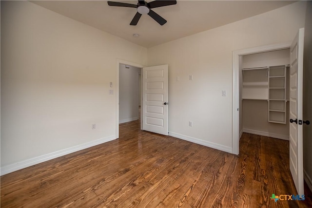 177 Powderhorn Ln, Port Lavaca, TX 77979 - unfurnished bedroom featuring wood finished floors, a spacious closet, ceiling fan, and a closet