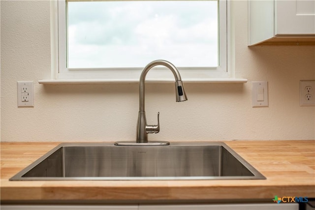 177 Powderhorn Ln, Port Lavaca, TX 77979 - kitchen view of butcher block countertops and white cabinets
