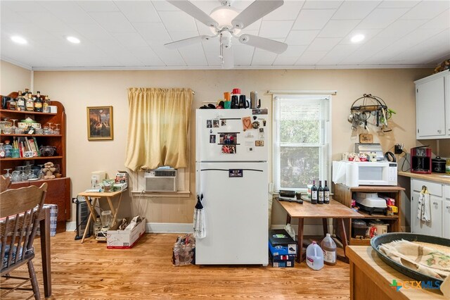 kitchen featuring ornamental molding, white cabinets, white appliances, ceiling fan, and light hardwood / wood-style flooring