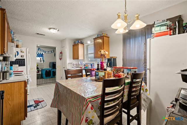 dining room with a textured ceiling