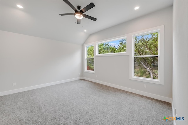 empty room with carpet, baseboards, vaulted ceiling, and recessed lighting