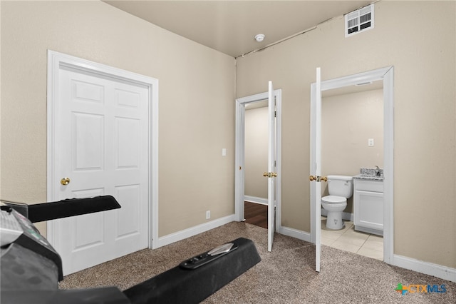 607 S Main St, Lampasas, TX 76550 - workout room with light carpet and baseboards