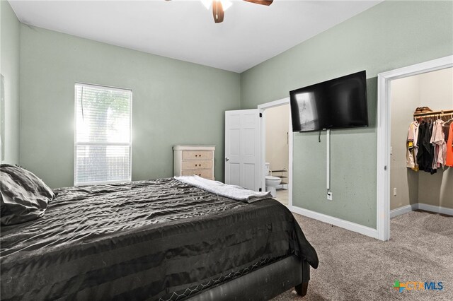 607 S Main St, Lampasas, TX 76550 - carpeted bedroom with a spacious closet, a closet, ensuite bath, and a ceiling fan
