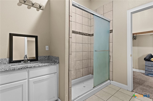 607 S Main St, Lampasas, TX 76550 - full bath featuring a stall shower, tile patterned floors, and vanity