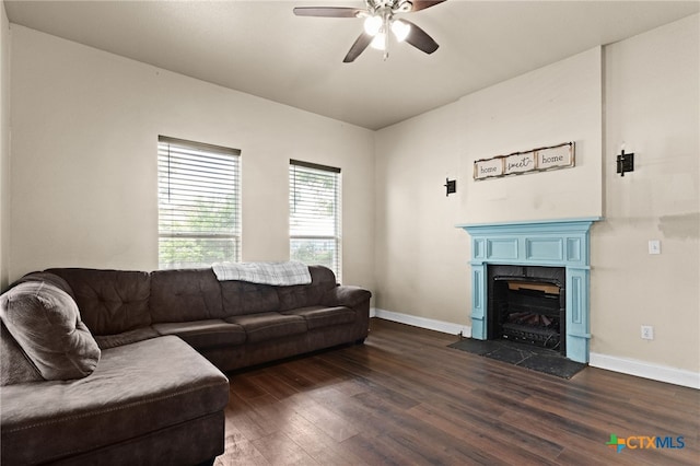 607 S Main St, Lampasas, TX 76550 - living room featuring dark wood-style flooring, ceiling fan, and a premium fireplace
