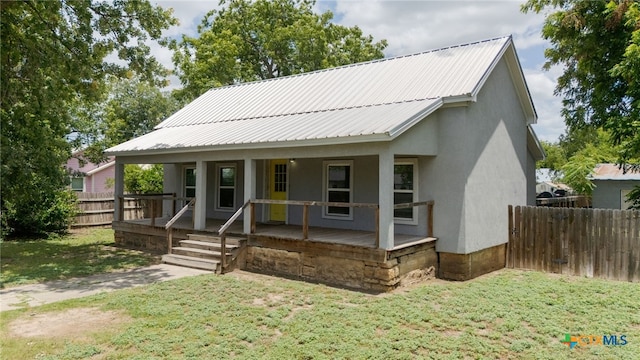 607 S Main St, Lampasas, TX 76550 - view of front of home with a porch, stucco siding, and a metal roof