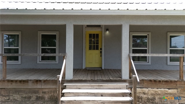 607 S Main St, Lampasas, TX 76550 - doorway to property with stucco siding and covered porch