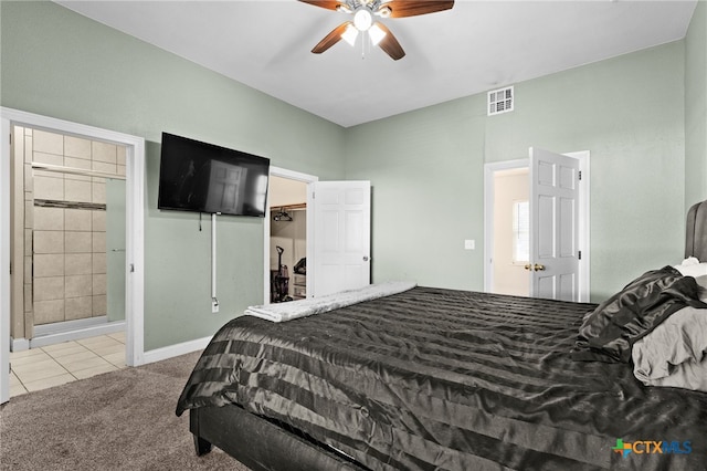 607 S Main St, Lampasas, TX 76550 - bedroom with carpet floors, tile patterned floors, a spacious closet, ceiling fan, and a closet