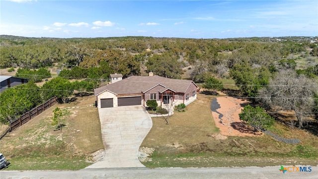 aerial view featuring a view of trees