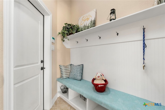 mudroom with light tile patterned flooring