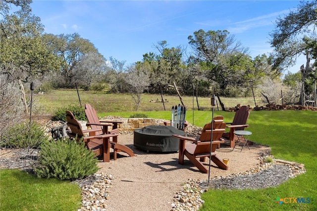 view of patio featuring a fire pit