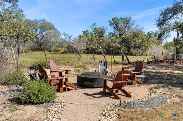 view of patio featuring an outdoor fire pit