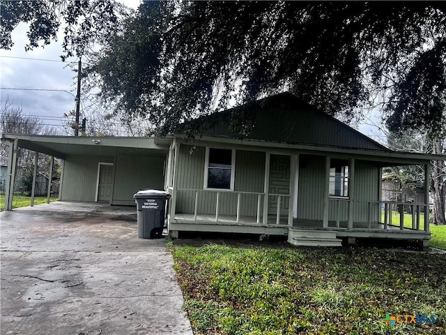 view of front of house with a carport and covered porch