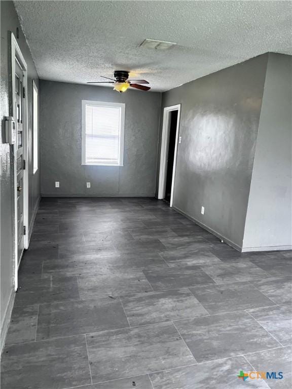 unfurnished room featuring ceiling fan