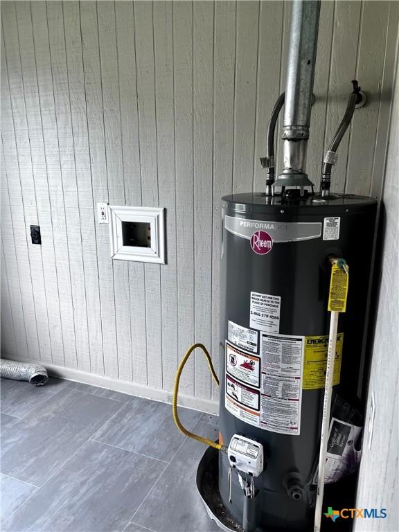 utility room with water heater