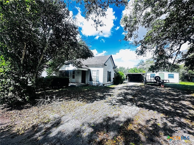 view of side of property featuring a sunroom