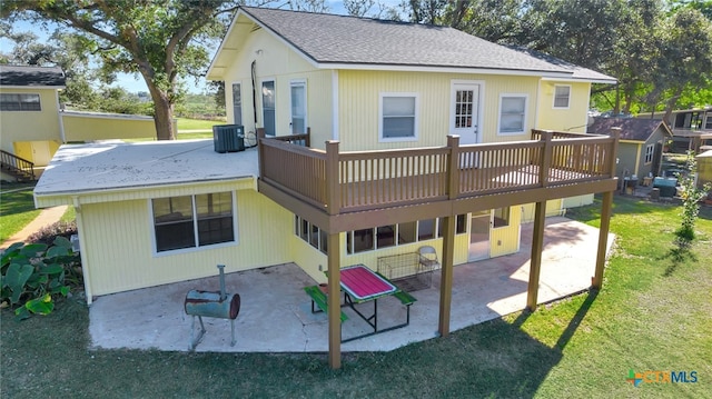 back of property with a yard, central AC unit, a patio area, and a wooden deck