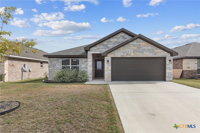 view of front of property with a garage and a front yard