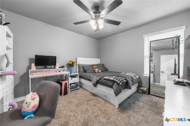 carpeted bedroom with ceiling fan