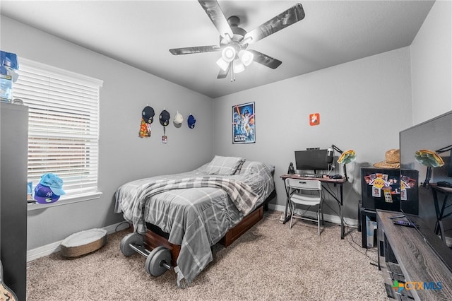 bedroom featuring light colored carpet and ceiling fan