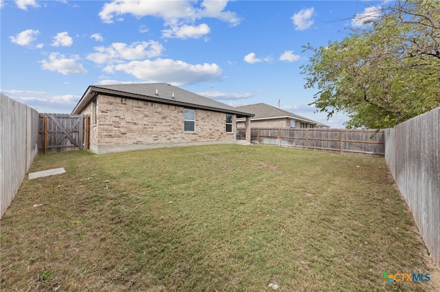 back of house featuring a yard