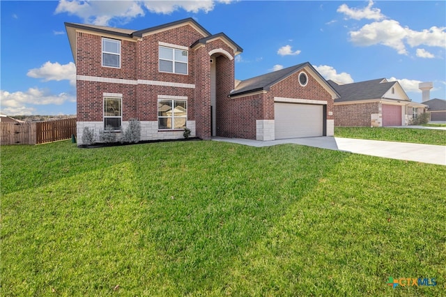 view of property featuring a garage and a front lawn